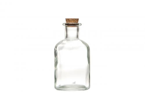 Liten glasflaska med kork. Använd som ljusstake för kronljus eller som liten vas för blommor.